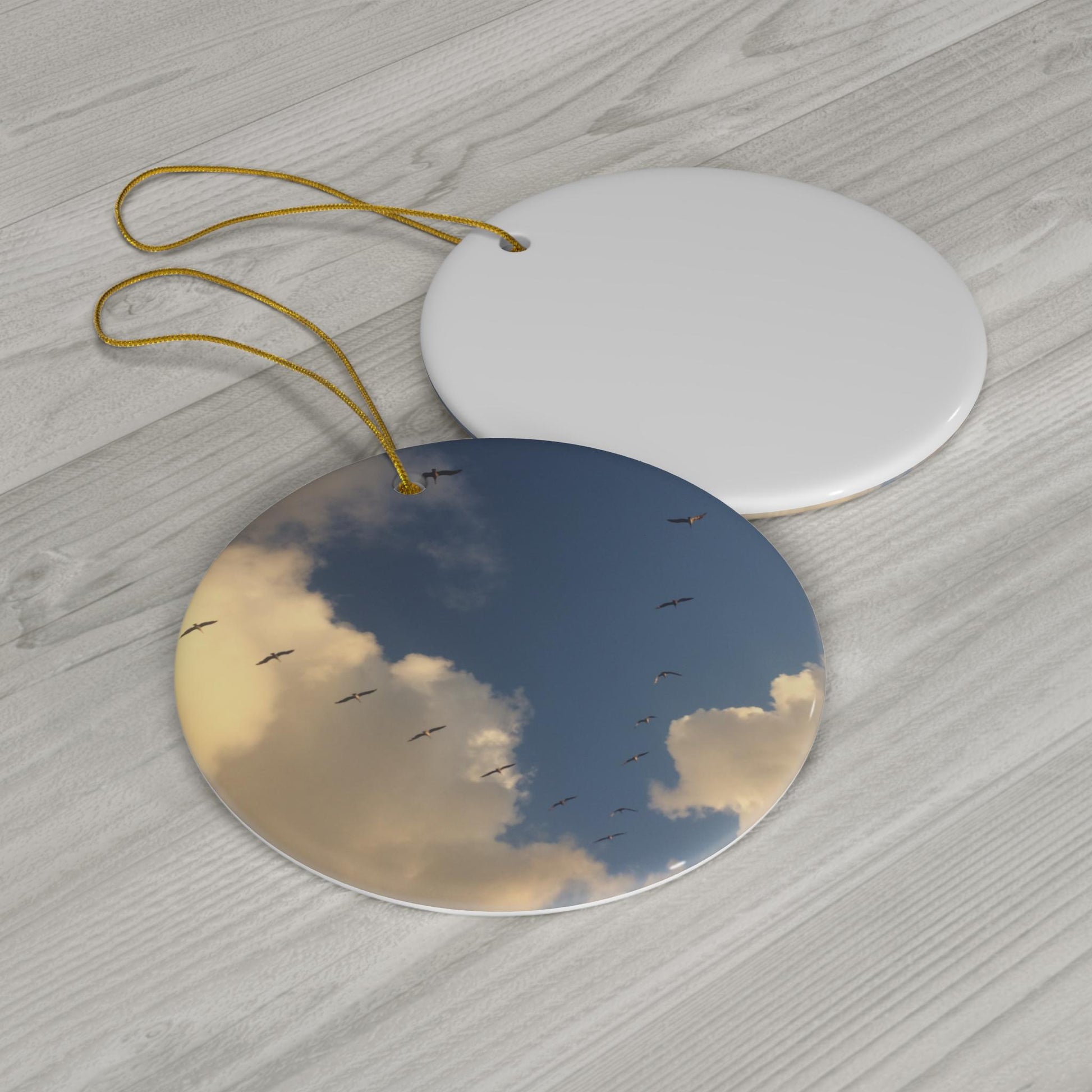 Christmas Ornament With blue skies and a migrating flock of sandhill cranes