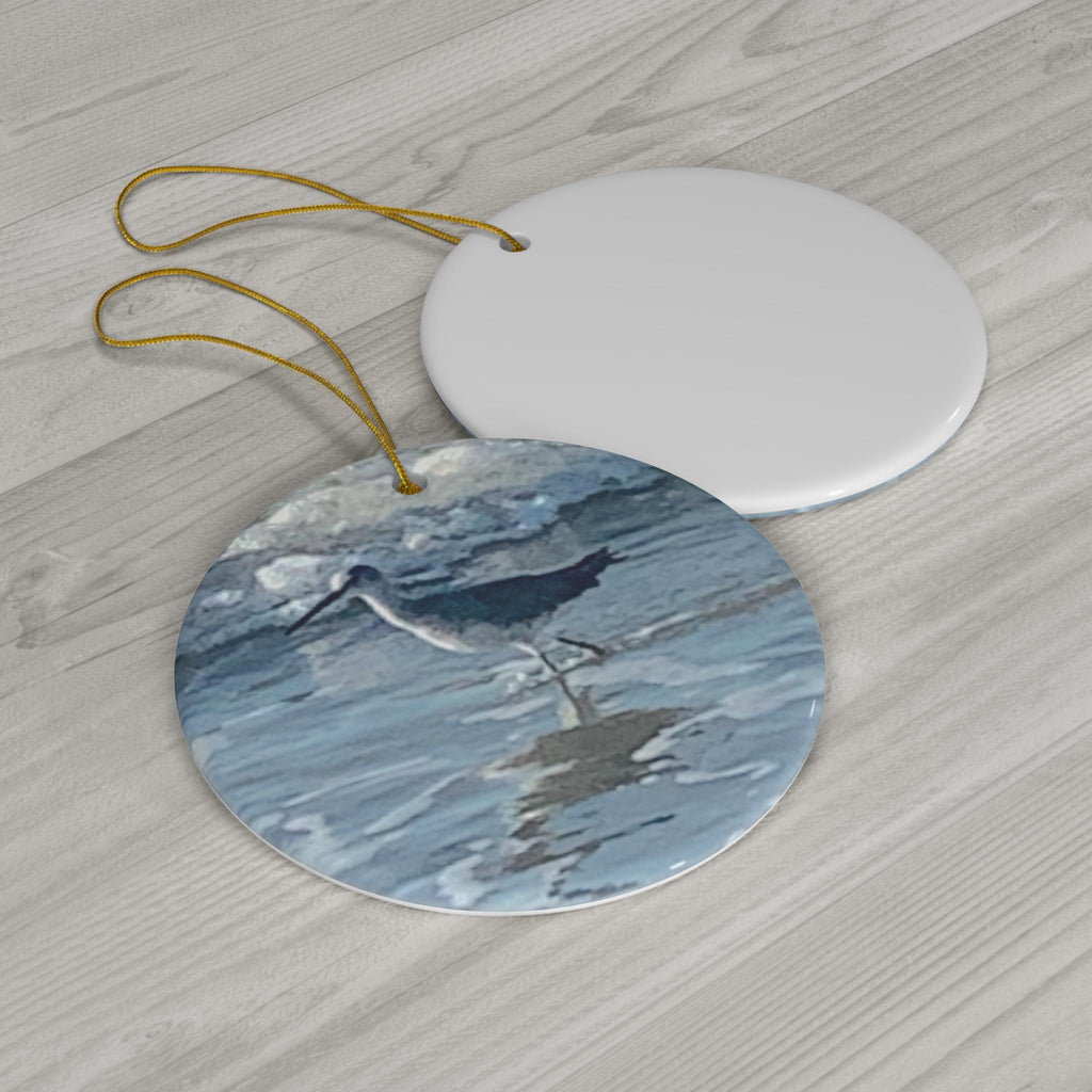 Christmas Ornament featuring an Oyster Catcher in the Hilton Head Island Surf
