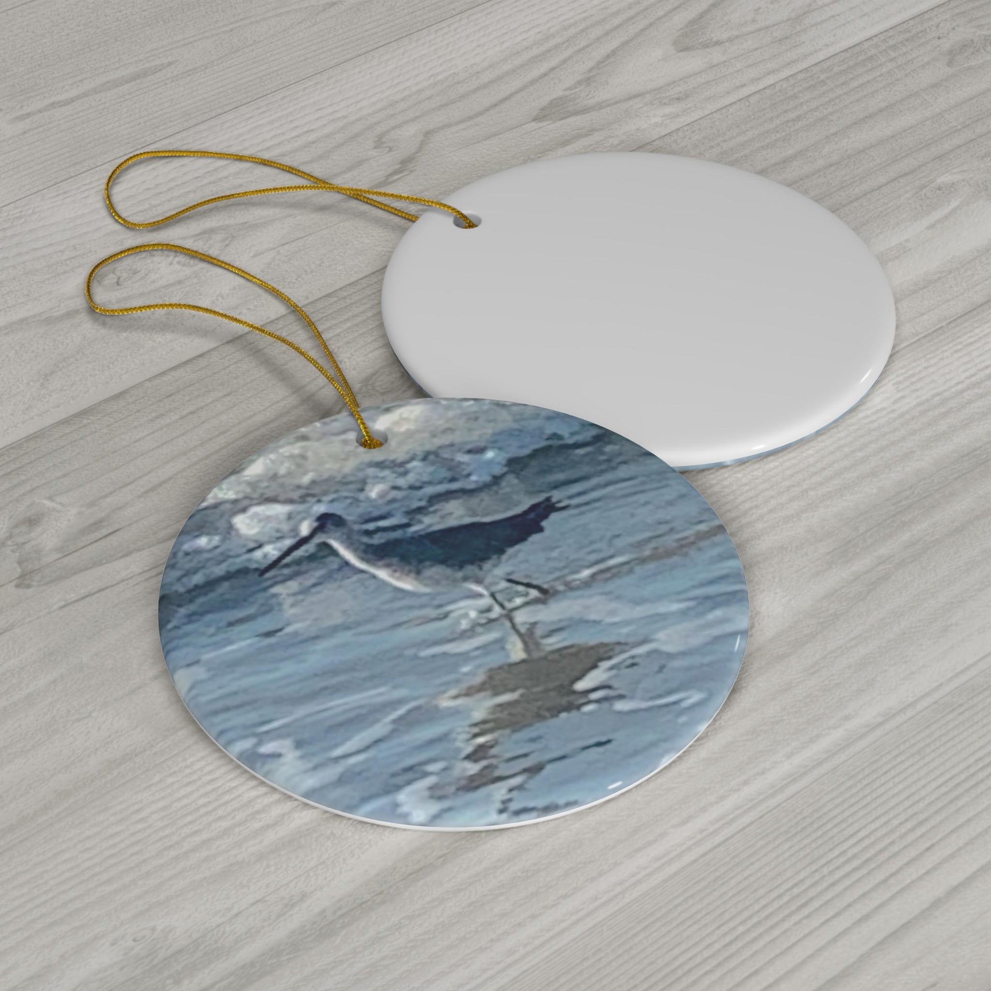 Christmas Ornament featuring an Oyster Catcher in the Hilton Head Island Surf